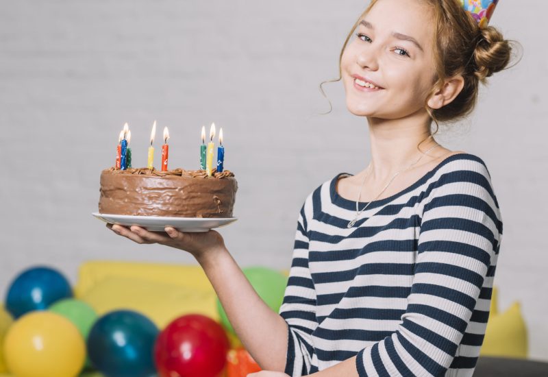 portrait-happy-girl-holding-delicious-cake-white-plate-party-scaled.jpg